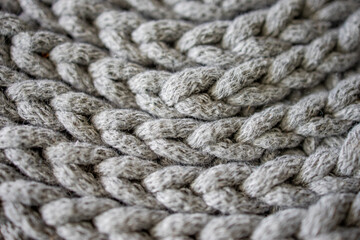 interesting background made of crochet hand-made, gray cotton cord