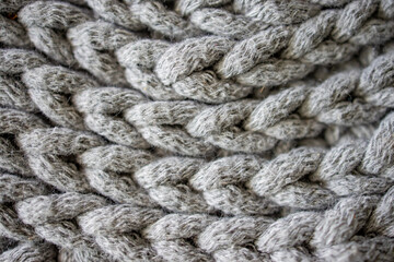 interesting background made of crochet hand-made, gray cotton cord