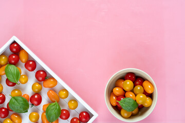 fresh italian cherry tomatoes on the vine in a wooden crate on a white background