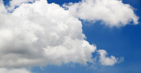 Naklejka na ściany i meble Blue sky and bright white clouds
