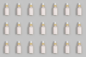 Cosmetic pattern. Pink anti-aging collagen, facial serum in transparent glass bottle with gold pipette on grey background. Natural Organic Spa Cosmetic Beauty Concept