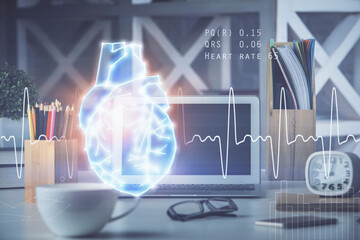 Desktop computer background and heart drawing. Double exposure. Medical study and healthcare concept.