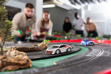 Models of race cars on track