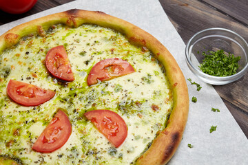 tasty pizza on the wooden background