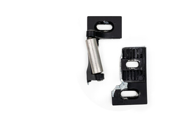 Broken strike plate from a push bar of a residential or commercial fire exit door. Broken by thieves / burglars with a crowbar. Isolated on white, top view.