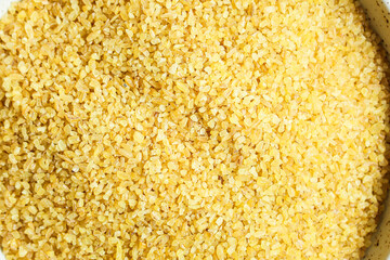 bulgur crushed raw grain Menu concept serving size. food background top view copy space organic healthy eating keto or paleo diet