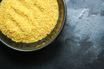 bulgur crushed raw grain Menu concept serving size. food background top view copy space organic healthy eating keto or paleo diet