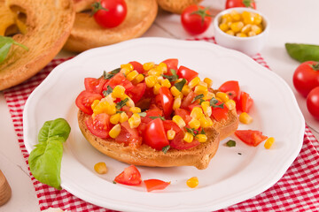 Friselle with tomatoes and mais.
