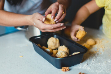 
children's hands make cookies