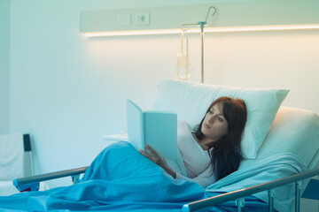 Female patient reading a book