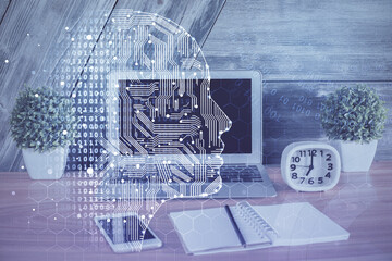 Multi exposure of work table with computer and brain hologram. Brainstorm concept.
