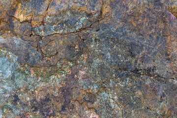 colored rocky stones of natural origin, background for walls and wallpapers, highlighted texture of the material, natural color blocks
