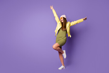 Fototapeta na wymiar Full length body size view of her she nice-looking attractive fashionable cheerful cheery girl dancing having fun isolated over bright vivid shine vibrant lilac purple violet color background
