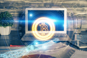 Multi exposure of blockchain theme hologram and table with computer background. Concept of bitcoin...