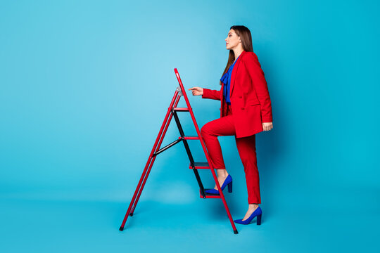 Full body profile photo of attractive professional lady successful worker coming up career ladder wear trend red suit blouse shirt blazer trousers high-heels isolated blue color background