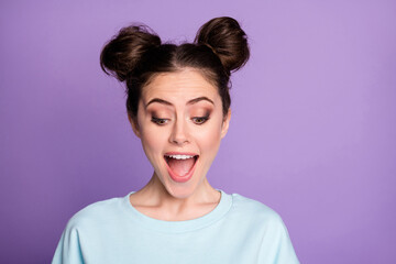 Portrait of astonished positive cheerful girl youth look down see incredible black friday sales impressed wear sporty style outfit isolated over violet color background