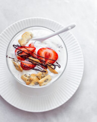 fresh strawberry in bowls with whipped cream
