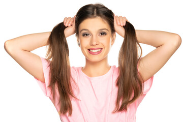 Fototapeta premium Portrait of young beautiful happy woman with ponytails