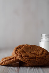 Tasty cookies and a glass of milk in a transparent glass on a white background
