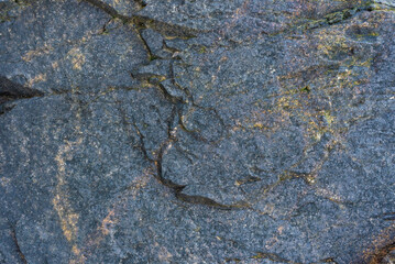 colored rocky stones of natural origin, background for walls and wallpapers, highlighted texture of the material, natural color blocks