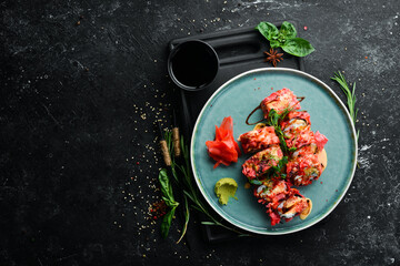 Sushi rolls with seafood are cooked in tempura. Japanese food. Top view. Rustic style.