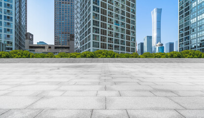 Fototapeta premium Empty city square road and modern business district office buildings in Beijing, China