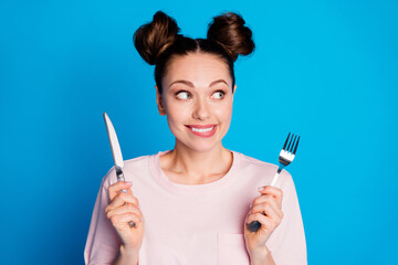 Photo of pretty funny hungry lady two funny buns hold fork knife wait tasty meal excited dinner...