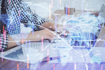 Multi exposure of businessman working on laptop on background. International business hologram in front. Concept of success.