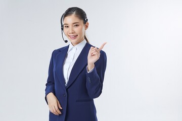 Call center Asian female, smiling business woman, customer Service Agent with headset isolated over...