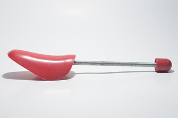 Red Plastic Shoe Tree on White Isolated Background