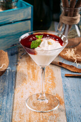 Sweet cherry jam dessert with cream martini glass 