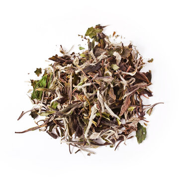 Heap of Bai Mu Dan (White Peony) chinese white tea isolated on a white background.