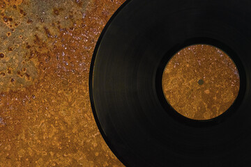Gramophone record on a rusty iron background