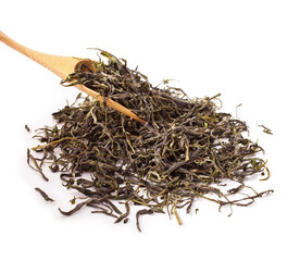 Huangshan Maofeng (Yellow Mountain Fur Peak) green chinese famous tea in a wooden scoop isolated on a white background.