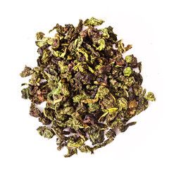 Heap of Tieguanyin chinese Oolong tea isolated on a white background