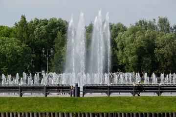Water fountain in the city park summer