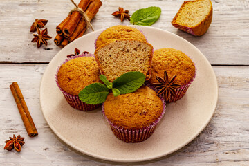 Homemade cupcakes with cinnamon, star anise and fresh mint. Autumn good mood, warm weather
