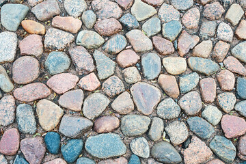 cobblestone pavement made of round stone around the ancient Peter and Paul Fortress in St. Petersburg, Russia