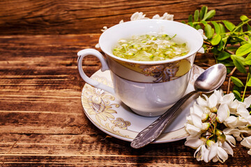 Tea from fresh acacia petals. Hot drink, alternative medicine