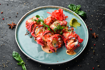 Sushi rolls with seafood are cooked in tempura. Japanese food. Top view. Rustic style.