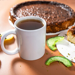 Tasty colorful chocolate cake with tea cup close up