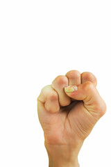 a woman's hand is clenched into a fist showing strength against a white background