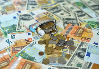 coins fall from the wallet to the table