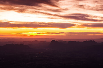Beautiful Asian limestone mountain landscape sunrise at Pha Nok An cliff in Phu Kradueng National park. Loei - Thailand