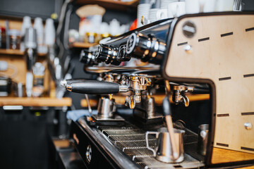 Professional commercial coffee machine in a cafe - professional barista makes espresso
