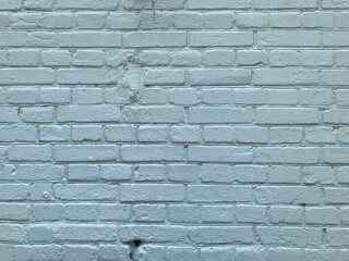 background brick wall painted in light blue