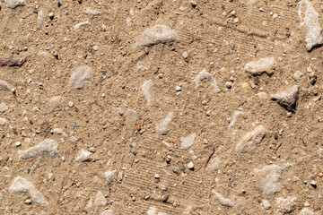 Sandy gravel road. Close-up. Abstract natural background.