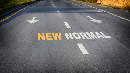 New normal word with white arrow on road, Business challenge concept and keep moving idea