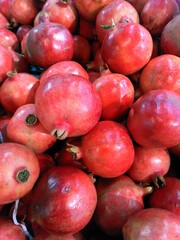 red pomegranate displayed in the market ,uae .