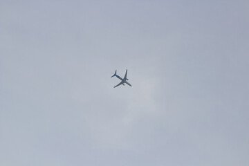 tourist plane in the sky,high in the sky a passenger plane flies to the resort